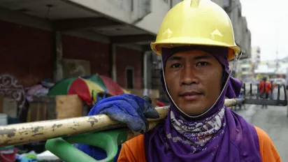 Worker removing debris in the Philippines 