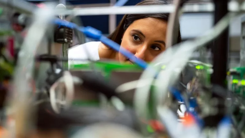 Women looking through wires