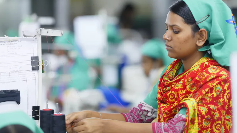 Woman working on sewing maching