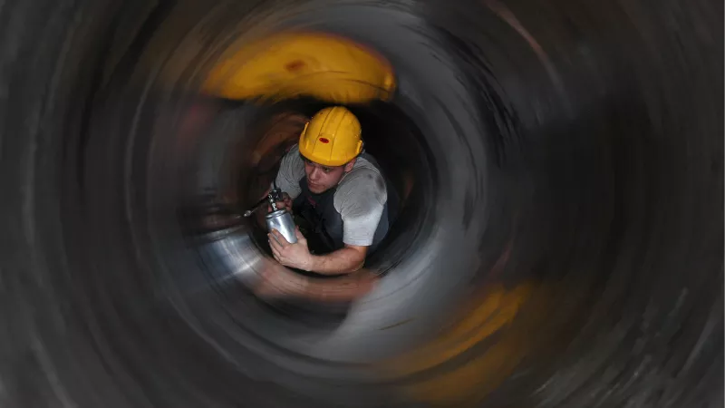 Photo shows a young man doing a hard job in a tunnel in Djerdap, Serbia.